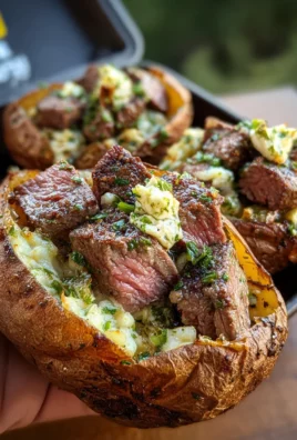 Grilled Steak Bite Loaded Baked Potatoes with Garlic Herb Butter